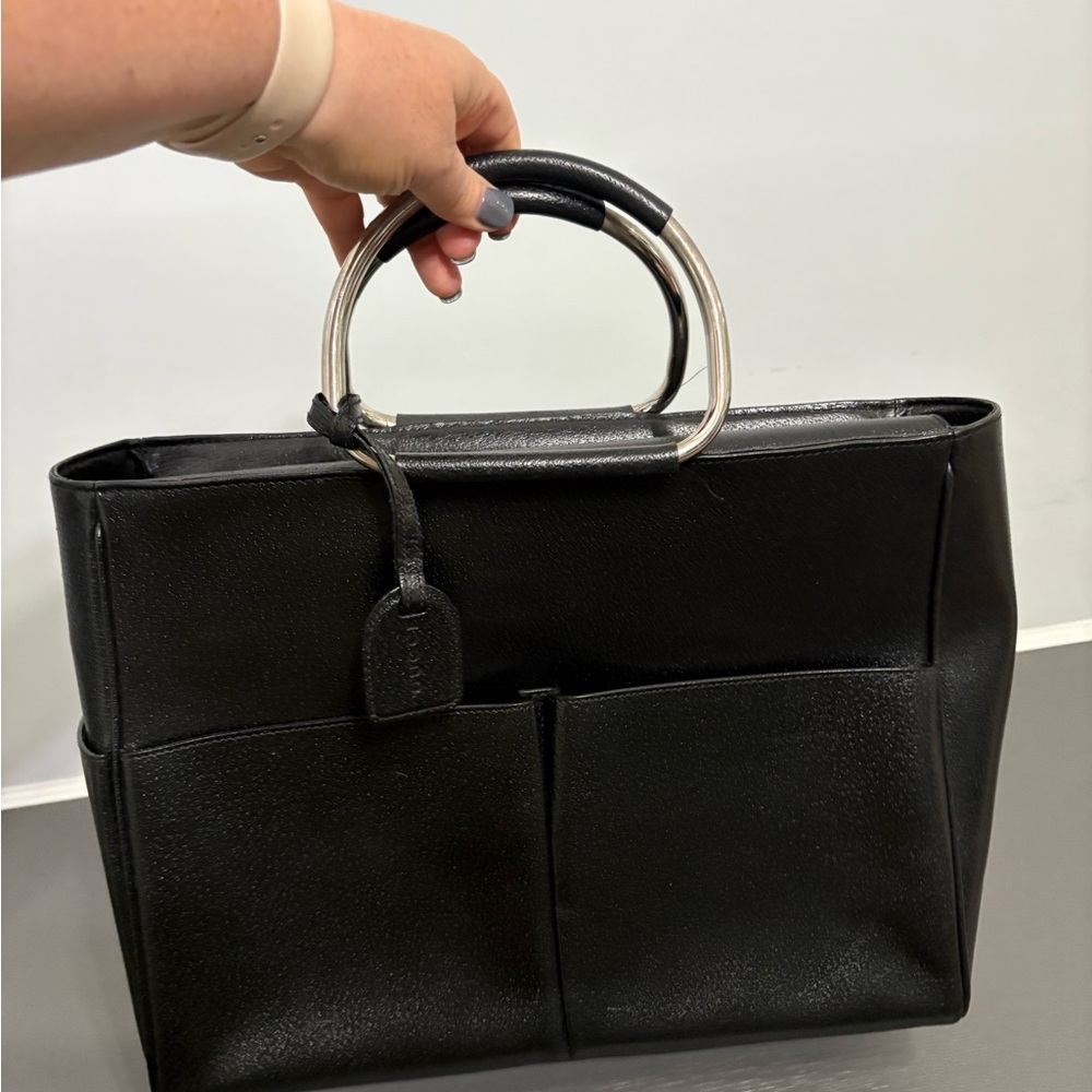 Black Gucci with silver handles